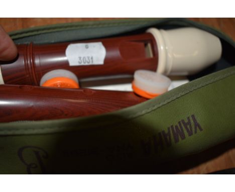 A vintage Alto recorder, plastic moulded body (rosewood effect) with case and accessories