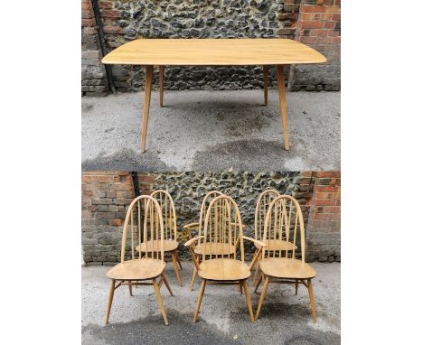 A blonde elm Ercol Windsor dining table together with a set of six matching hoop and spindle back chairs, paper label to unde