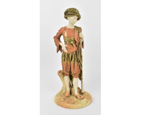 A 19th century Royal Worcester blush ivory porcelain model of an Oriental hunter, leaning on his rifle, probably designed by 