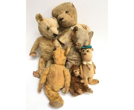 Selection of well-loved mohair teddy bears in need of repair, together with a felt hand puppet and a Merrythought Yogi Bear. 