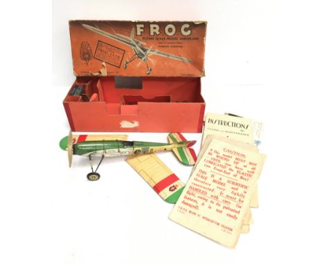 Frog Flying Scale Model Aeroplane Mark IV Interceptor Fighter: tinplate aircraft in green/cream/red livery with paper wings, 