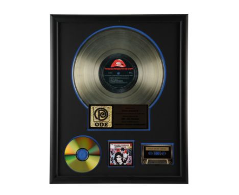 ROCKY HORROR PICTURE SHOW, THE (1975) - The Rocky Horror Picture Show Gold Disc Award Presented to Susan Sarandon - A gold di