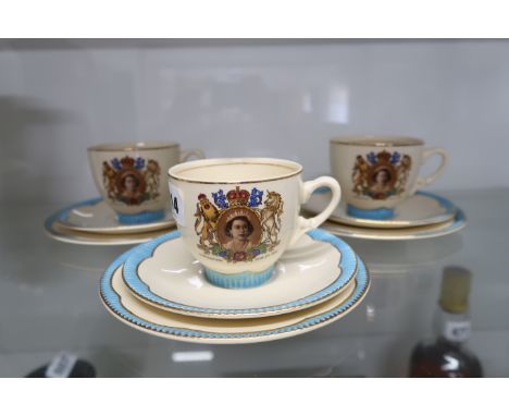 Three trio's of Clarice Cliff ER11 Coronation Ware - Cup, Saucer and Plate