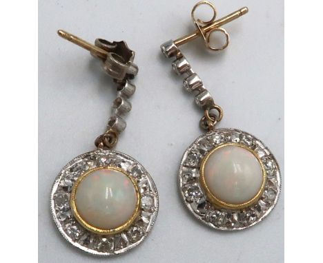 A pair of diamond and opal drop earrings each designed as a single cut diamond line suspending a circular opal cabochon withi