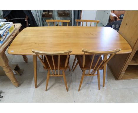 An Ercol blonde table and four chairs - Width 75cm x Length 152cm x Height 72cm 