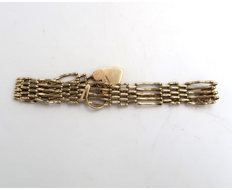 A hallmarked 9ct yellow gold gate link bracelet with heart shaped clasp.13.8 grams 16cm long. Condition good. 