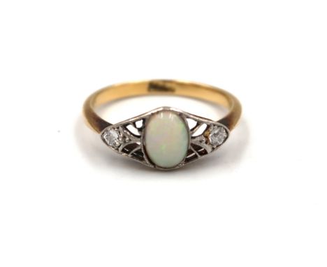 An 18ct yellow gold hallmarked dress ring with oval opal to shoulder flanked by diamonds - ring size M - approx weight 2.3 gr
