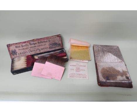 A quantity of gold leaf with gold brushes and working tools, boxed - condition commensurate with age