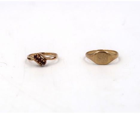 A 9ct yellow gold hallmarked three stone garnet dress ring size K/L - approx weight 1.4 grams along with a 9ct (tested) yello