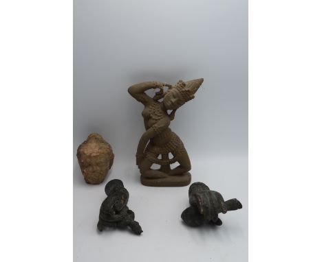 A stone apsara figure 22cm high, a pair of bronze hands, one holding a fish the other a seated Buddha approx 13cm long, and a