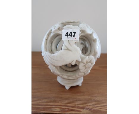 A white jade six layer puzzle ball, 12cm in diameter, carved with bird, flowers and spray, in good condition