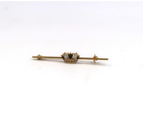 An early twentieth century naval sweetheart brooch. With enamel crown and seed pearl decoration. Stamped 15ct. Weight 2.07 gr