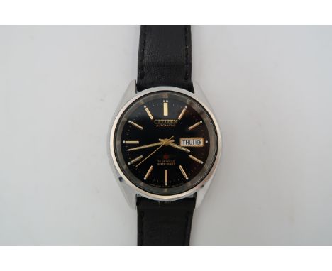A gents Citizen automatic wristwatch in stainless steel case, black enamel dial with baton markers 21 jewel movement, day dat