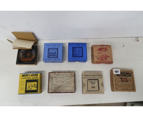 Eight boxes of Magic Lantern slides including Mickey Mouse, The Boer War