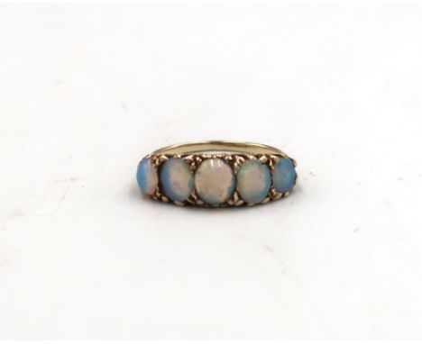 A tested 9ct yellow gold and five oval opal ring size K - approx weight 3.3 grams - clean and bright 