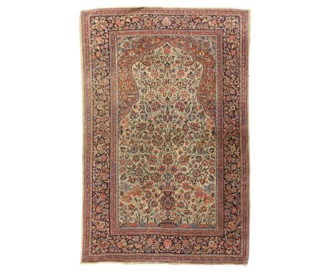 A Persian Sarouk rug, third quarter 20th century, the central field with vase of flowers design, on a beige and terracotta gr