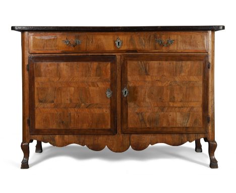 A North European inlaid walnut buffet, last quarter 18th century, long drawer above two doors and shaped apron, on curved fee