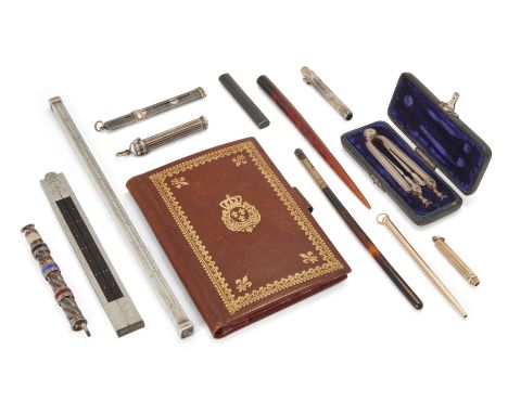 A collection of architectural and writing instruments, comprising: a French silver and ebony mounted twelve inch folding rule