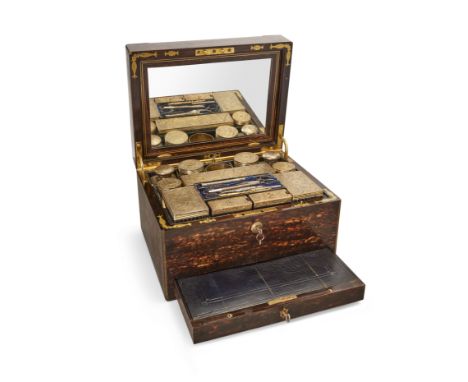 A Victorian coromandel vanity case, mid-19th century, the hinged lid with monogrammed cartouche enclosing a removable mirror,