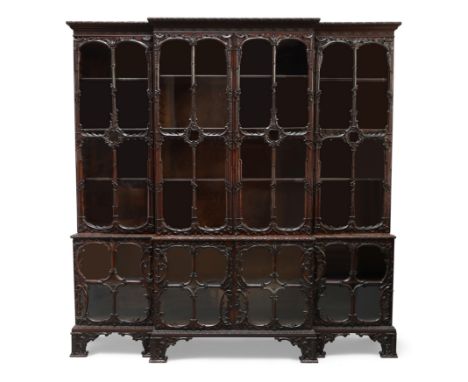 An English carved mahogany breakfront bookcase, in the manner of Thomas Chippendale, 19th century incorporating earlier eleme