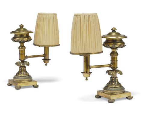 A pair of George IV lacquered-brass Argand oil lamps, second quarter 19th century, the shades by Robert Kime Ltd, each with v