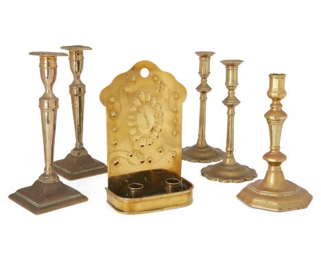 A group five brass English candlesticks, 18th / 19th century, comprising: an octagonal baluster candlestick, 22.5cm high; a p