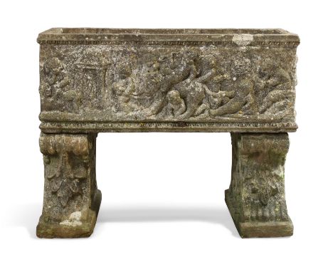 A reconstituted stone planter, second half 20th century, with a continuous relief depicting a procession of putti, on scrolle