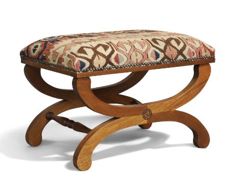 An English mahogany X-frame stool, of Regency style, 20th century, with kilim upholstered seat, 44cm high, 64cm wide, 46cm de