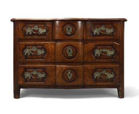 A provincial Louis XV fruitwood serpentine commode, first quarter 18th century, with three short over two long drawers, 82cm 