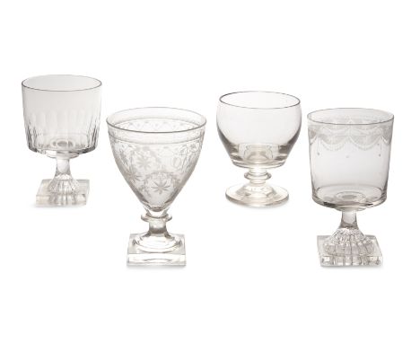 A group of four George III rummers, late 18th / early 19th century, comprising: one with bucket bowl engraved with a border o