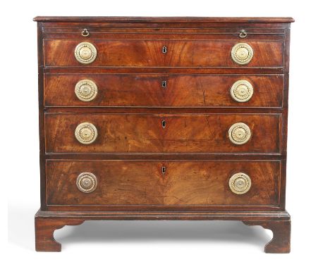 A George III mahogany chest, first quarter 19th century, the rosewood crossbanded top above brushing slide and four graduated