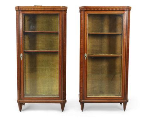 A near pair of Dutch inlaid satinwood and rosewood vitrines, 19th century, with canted corners, on square tapering feet to br