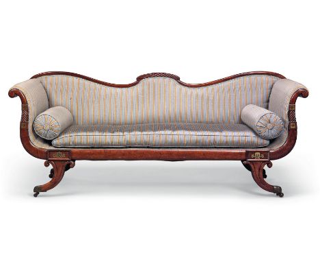 A Regency brass-inlaid mahogany sofa, first quarter 19th century, with shaped top rail and slender scrolling arms inlaid with