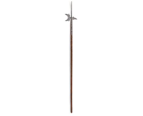 An Italian halberd, 16th century, the tapering central spike above a crescent shaped axe-blade with pierced holes and lugs to