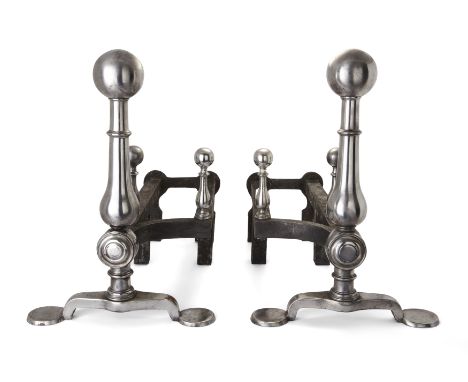 A pair of late Victorian steel and wrought-iron andirons, c.1890, each with spherical finial, the baluster uprights with pad 