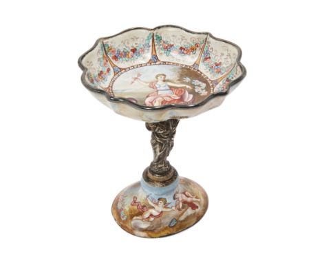 A Viennese silver-mounted enamel tazza, c.1890, the scallop shaped dish centred by Venus seated in a shell holding Cupid's ar