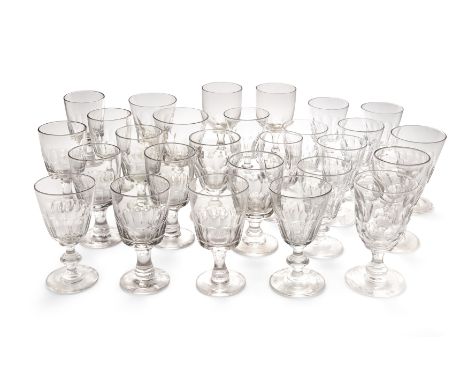 A large group of George III cut and faceted wine and water glasses, late 18th / early 19th century, comprising: a group of ei