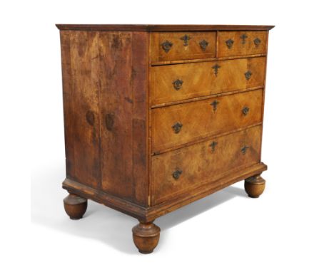 A Queen Anne inlaid walnut chest, first quarter 18th century, with two short over three long graduated drawers, on later feet