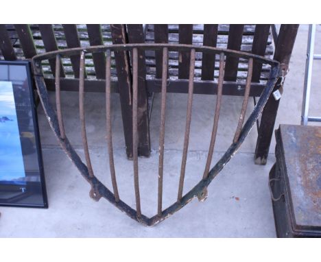 A VINTAGE CAST IRON CORNER HAYRACK