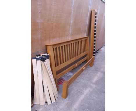 A MODERN LIGHT OAK 6FT BEDSTEAD