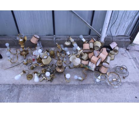 A LARGE QUANTITY OF VINTAGE BRASS LIUGHT FITTINGS AND BRASS TAPS