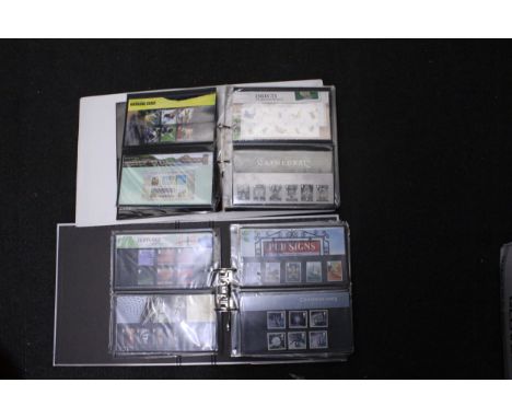 TWO ALBUMS CONTAINING APPROXIMATELY 110 FIRST DAY COVERS