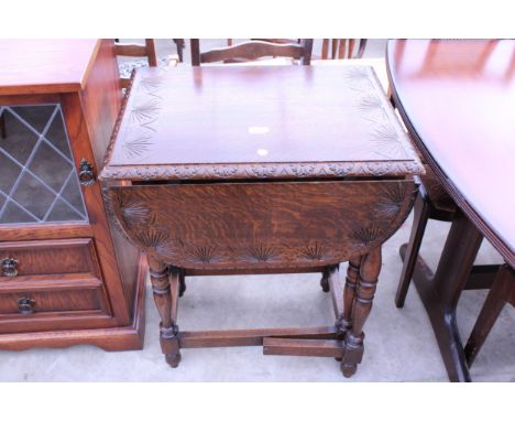 A SMALL OAK JACOBEAN STYLE GATE-LEG TABLE ON TURNED LEGS WITH CARVED TOP, 36" X 24" OPENED