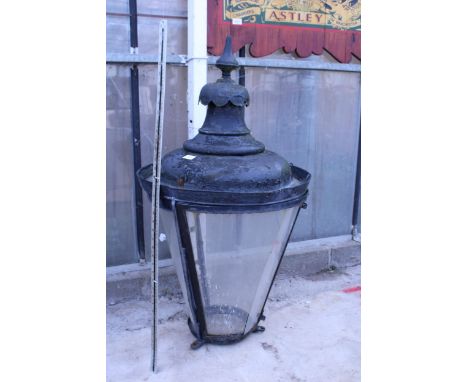A VINTAGE METAL AND GLASS COURTYARD LAMP TOP