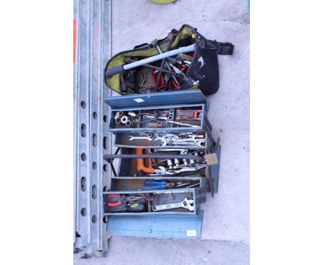 A TOOL BOX AND AN ASSORTMENT OF TOOLS TO INCLUDE SPANNERS, SOCKETS AND PLIERS ETC