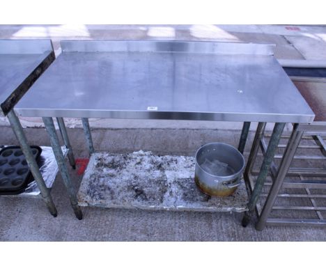 A STAINLESS STEEL KITCHEN WORK BENCH WITH LOWER SHELF