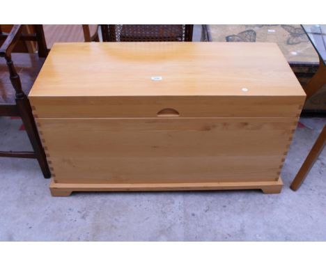 A LIGHTWOOD BLANKET CHEST WITH BRASS HINGES ON BRACKET FEET, 39.5" WIDE