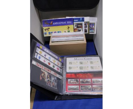 A BOX AND AN ALBUM CONTAINING FIRST DAY COVERS