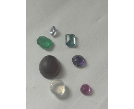 A QUANTITY OF GEMSTONES TO INCLUDE RUBY, TOURMALINE, AMETHYST, TOPAZ ETC TOTAL WEIGHT 11.5 CARATS. THE VENDOR STATES THAT ALL