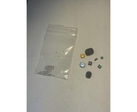 A QUANTITY OF GEMSTONES TO INCLUDE IOLOTE, GARNET, RUBY, EMERALD, SAPPHIRE ETC AND 1 CARAT OF DIAMONDS TOTAL WEIGHT 11.5 CARA